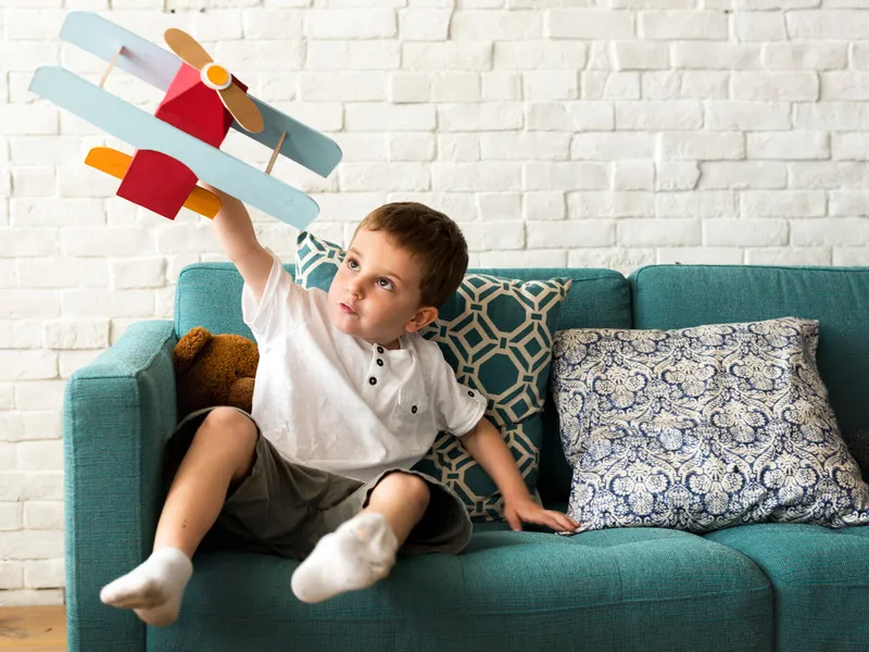 boy-playing-plane-toy-aspiration_53876-86048 (1)